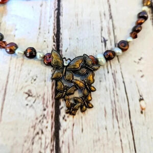 Vintage freshwater pearl and bead necklace, metal butterfly pendant, crystal